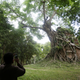 A tourist takes a picture at Sambor Prei Kuk.